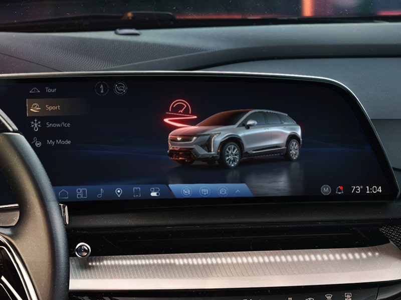 Driver mode options being displayed in the infotainment screen of the 2026 Cadillac OPTIQ electric SUV.