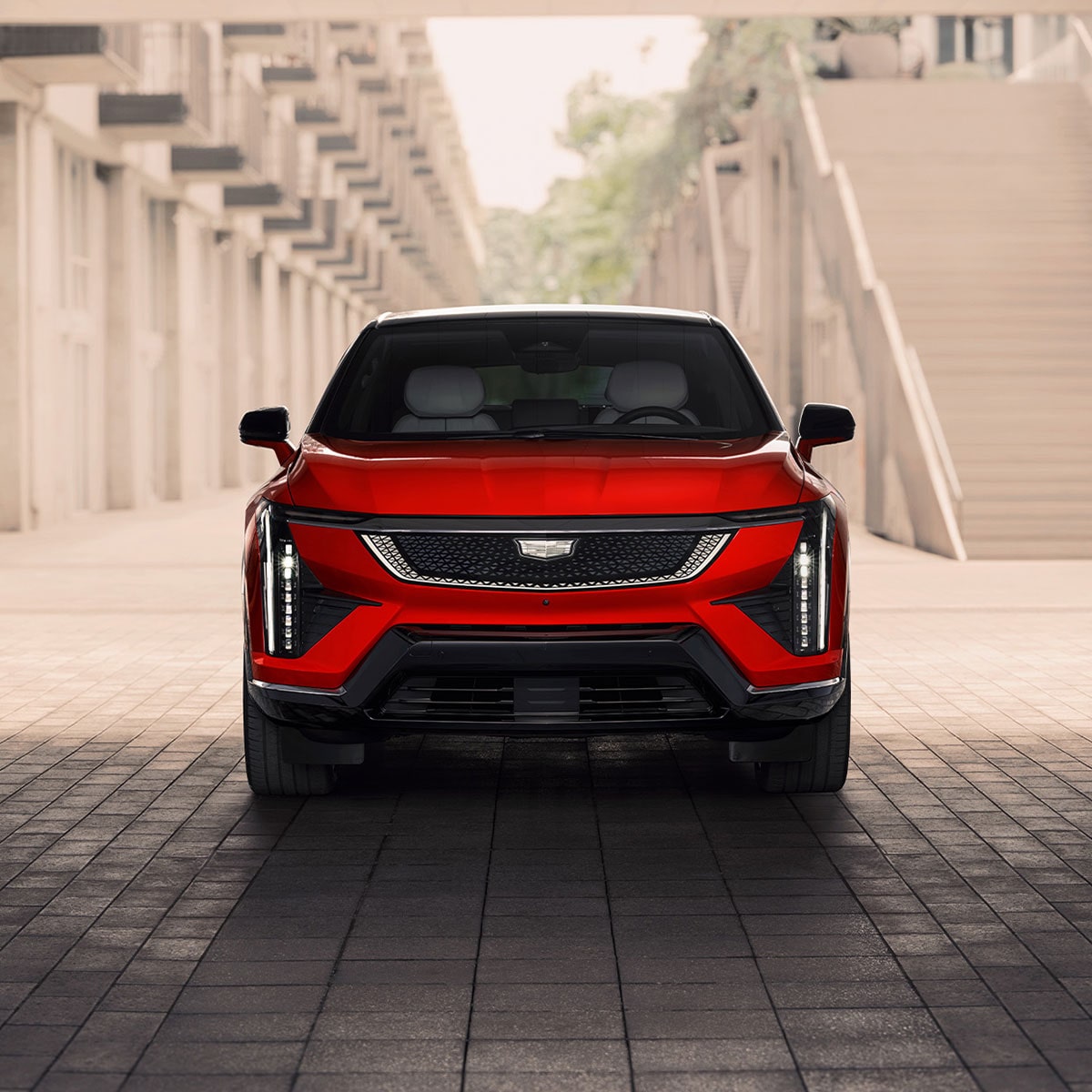Front view of the 2026 Cadillac OPTIQ parked under a shade.