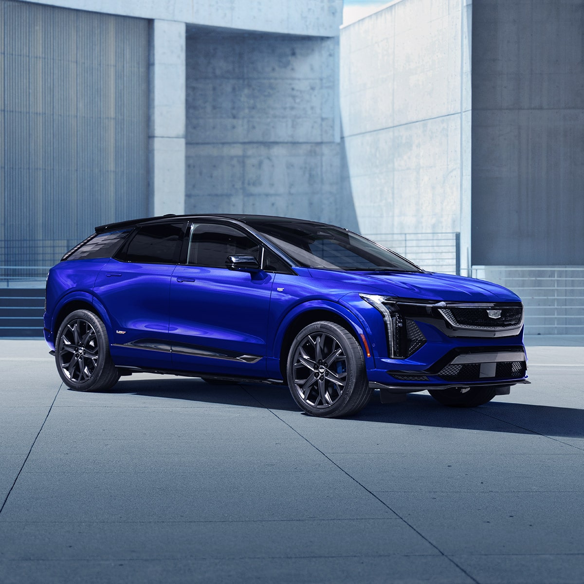 Side profile of the 2026 Cadillac OPTIQ-V in blue parked.