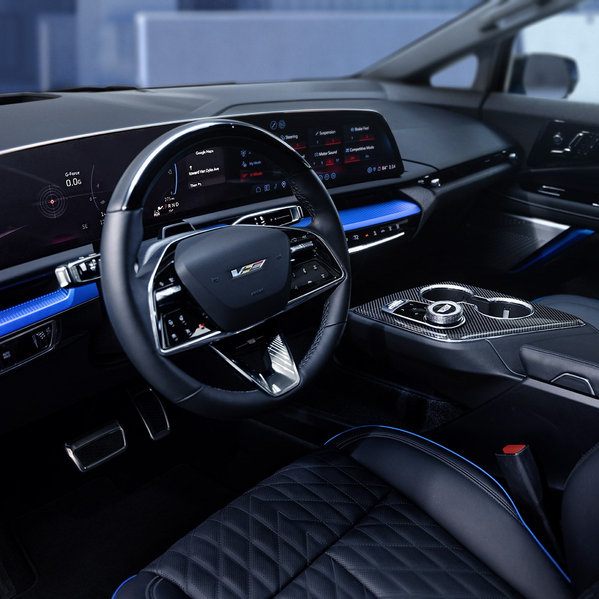 Interior shot showcasing the OPTIQ-V digital cockpit, steering wheel, and front seats.