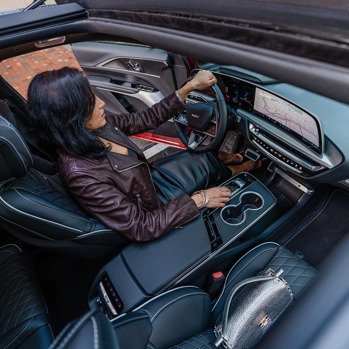 Overhead view of the 2027 Cadillac LYRIQ interior seen through the panoramic glass roof.