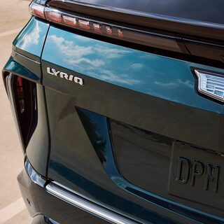 Close-up view of the LYRIQ badging etched on the exterior of the 2027 Cadillac LYRIQ.
