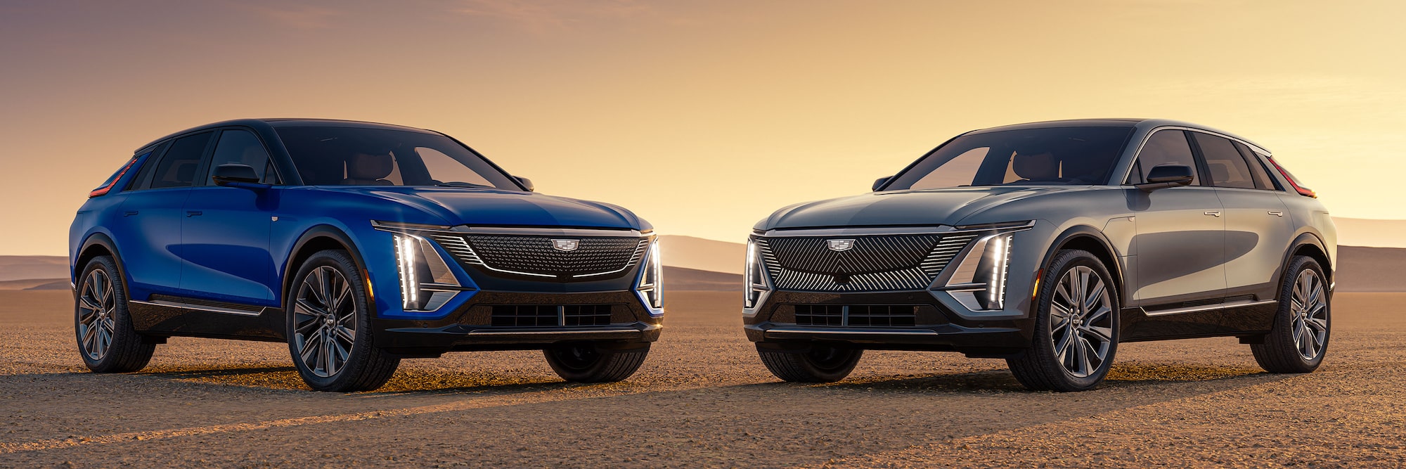 Two 2027 Cadillac LYRIQ Models Parked Side by Side Outdoors.