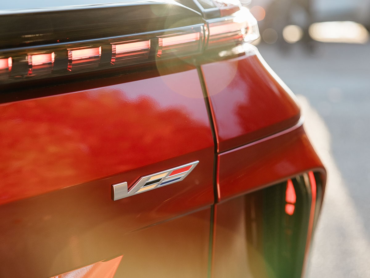 Close-up view of the V badging on the etched on the trunk of the 2027 Cadillac LYRIQ-V.
