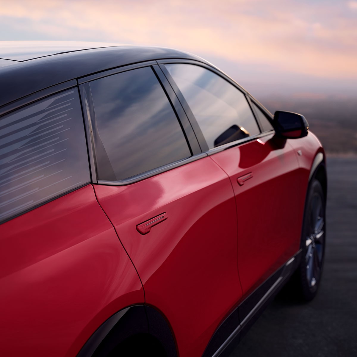 Vue extérieure latérale du passager d’une Cadillac OPTIQ rouge 2027.