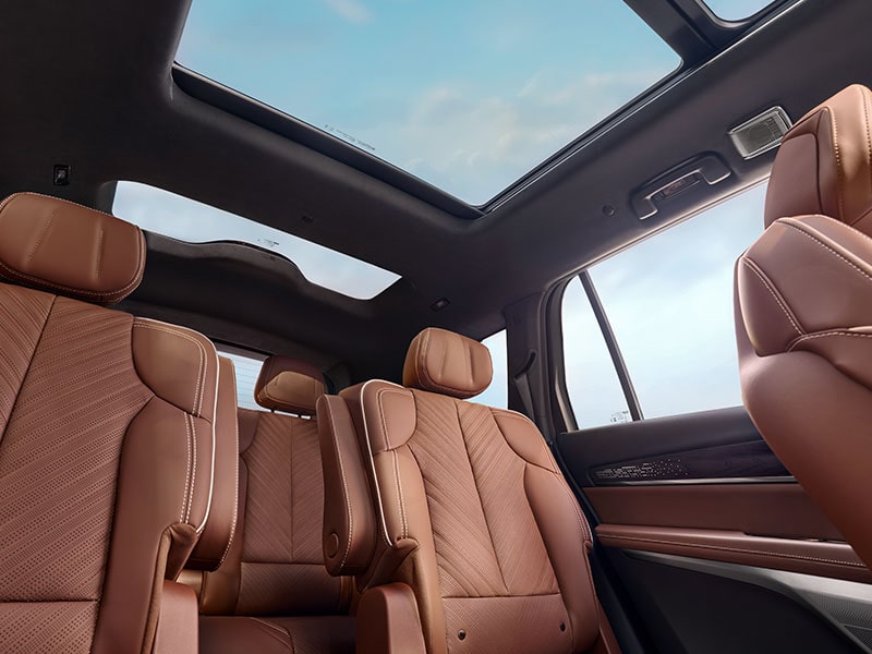 Floorboard View of the Cadillac VISTIQ's Two Brown Leather Back Rows and Dual Pane Sunroof.