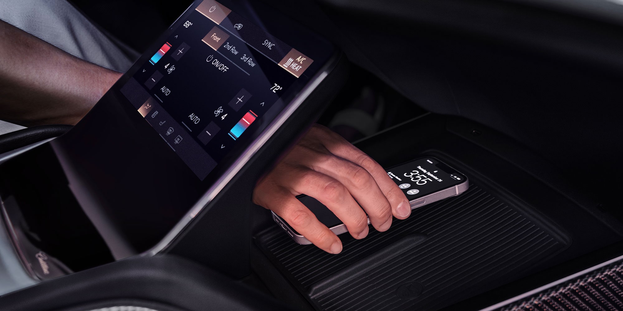 Someone Putting a Phone on the Charging Platform in the 2027 VISTIQ's Middle Console.