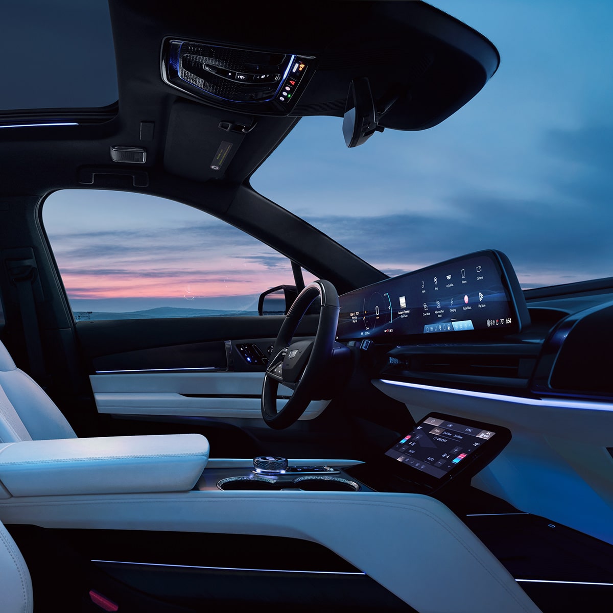 Vue du siège passager du siège conducteur et côté conducteur à l’intérieur du SUV électrique VISTIQ 2027 à trois rangées.