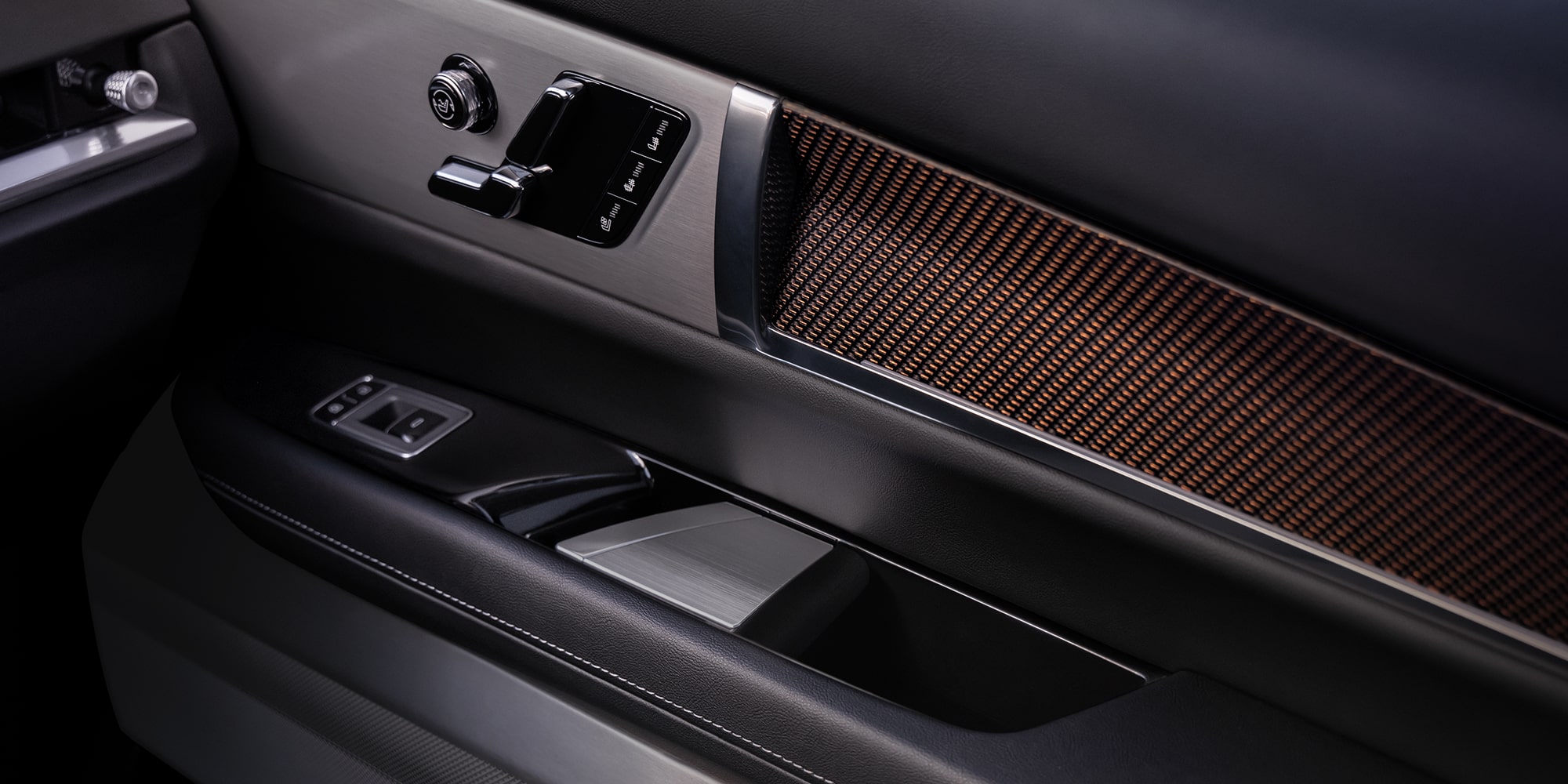 Close-up view of the 2027 VISTIQ AKG Door Speaker and Seat Controls.