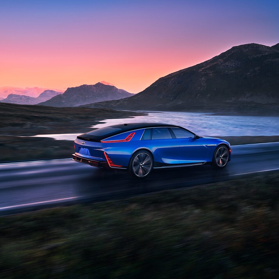 Cadillac CELESTIQ driving on the road with a scenic view.