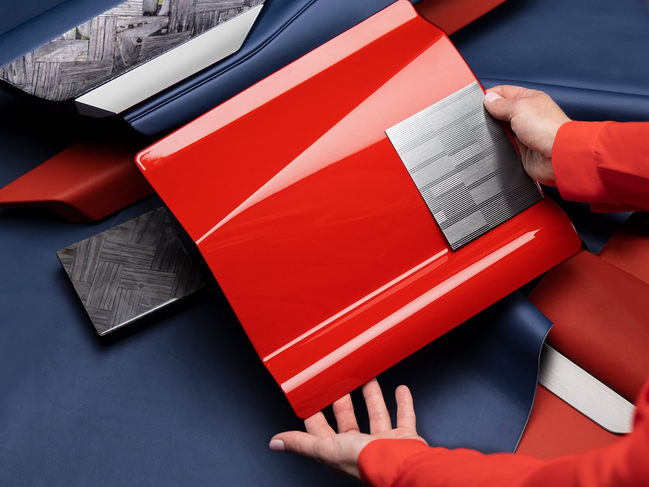Highlighting the Vermillion Metallic Paint and Acier Metallic Trim of the Cadillac CELESTIQ Aurora exterior.