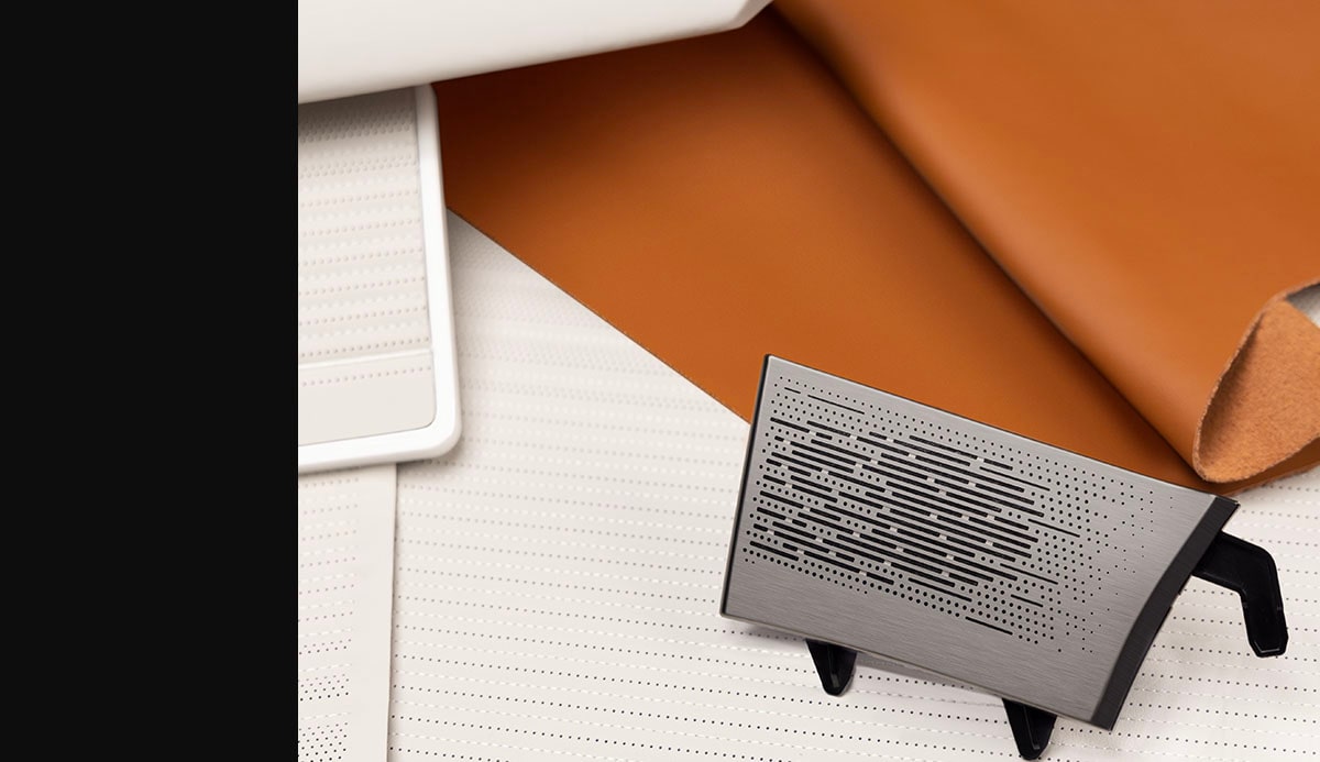 Cinnamon Leather, Venus Wood, and Jade Stainless Steel Speaker of the Cadillac CELESTIQ Mist design palette.