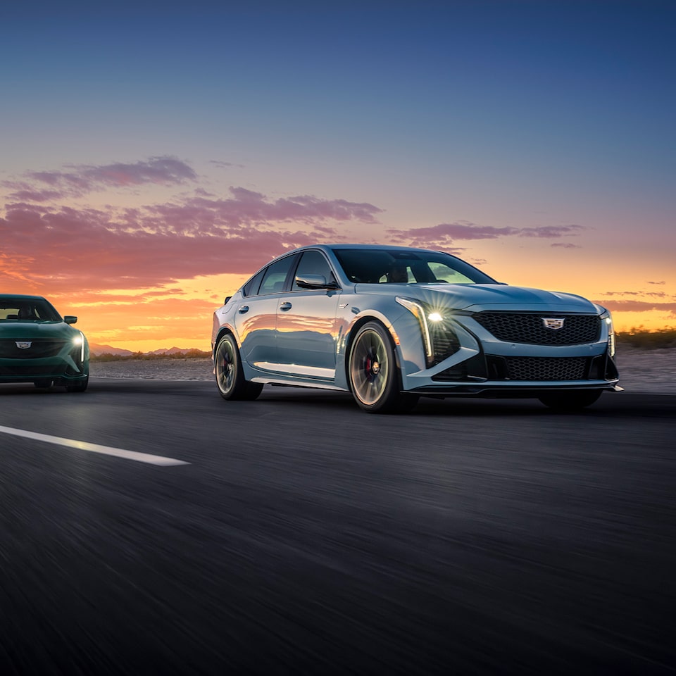 2025 Cadillac CT5-V sedan driving at sunset.