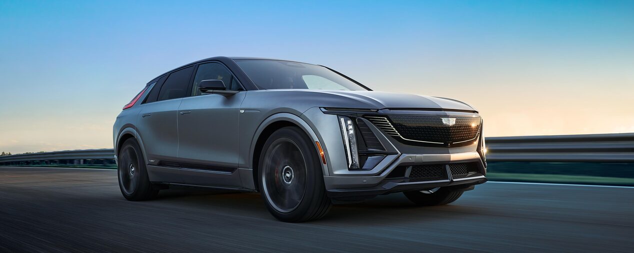 Front-side view of the 2026 LYRIQ-V driving alone on the road.