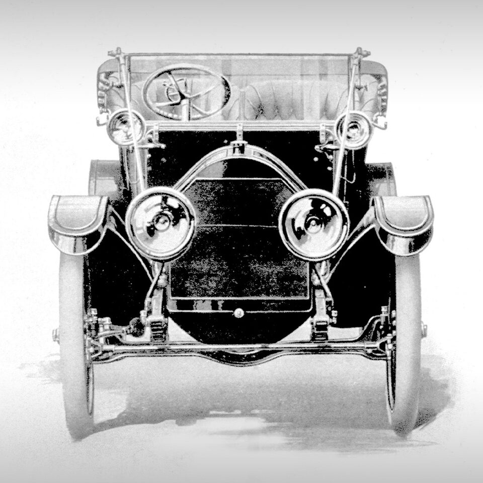 Celebrating the 120th anniversary of Cadillac with an iconic Cadillac vehicle in black and white.