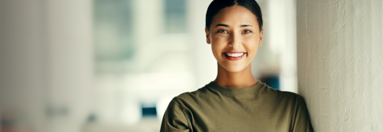 A smiling Canadian Forces personnel eligible for Cadillac's Canadian Forces Bonus Program.