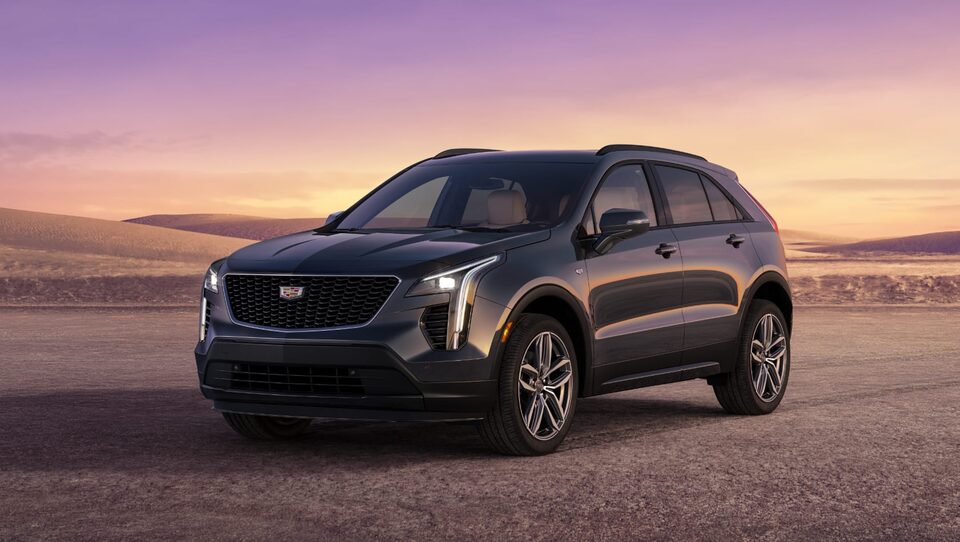 Cadillac SUV Parked on Gravel Path