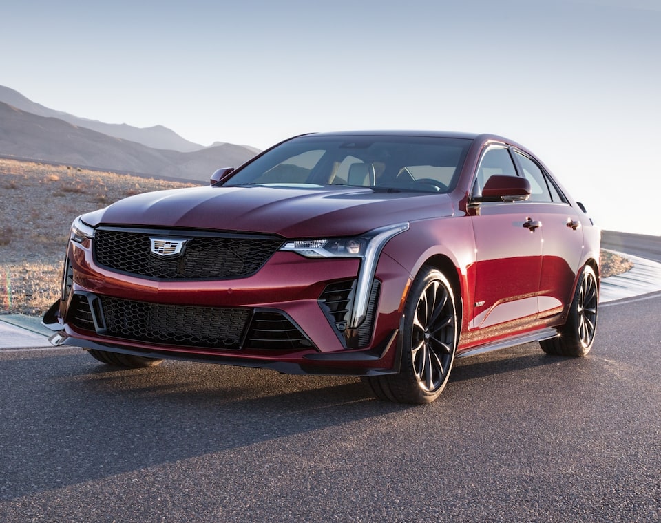 Front side view of the 2022 Cadillac CT4-V Blackwing driving on the road.