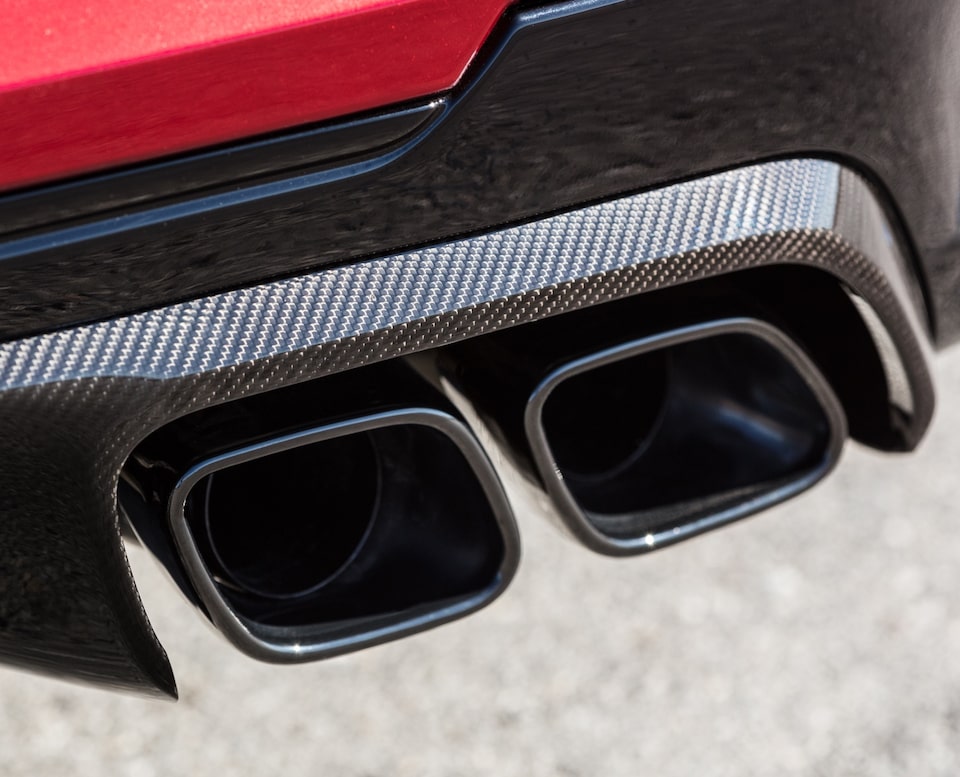 Close-up view of the 2022 CT4-V Blackwing dual exhaust pipes.