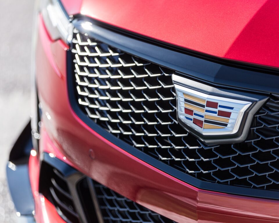 Close-up view of the 2022 CT4-V Blackwing front grille featuring the Cadillac insignia.