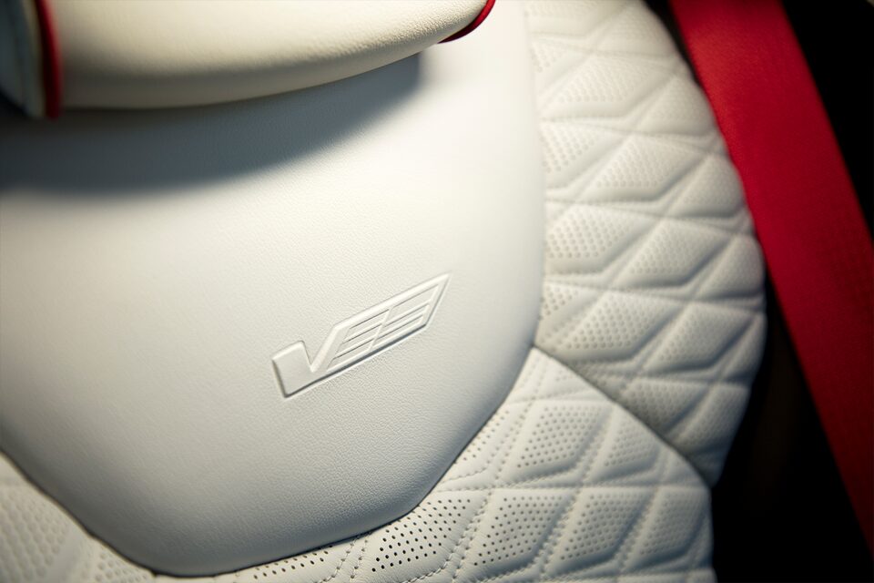 Close-up view of the 2022 CT4-V Blackwing Sueded-Microfibre Accents With Torch Red Seat Belts.