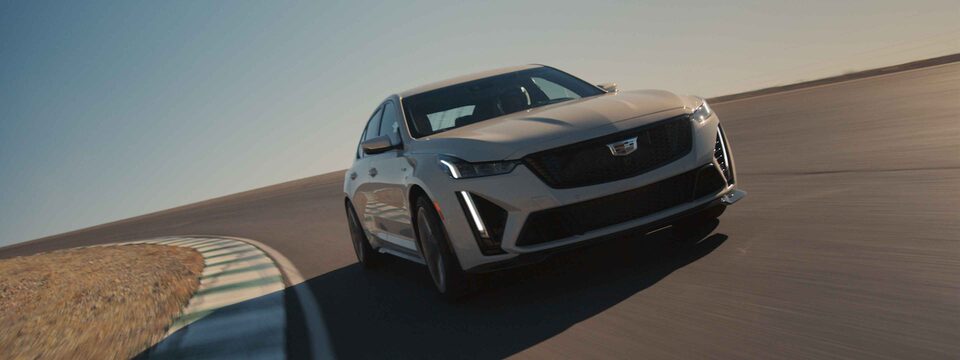 2022 Cadillac CT5-V mid-size sport sedan driving on the road.