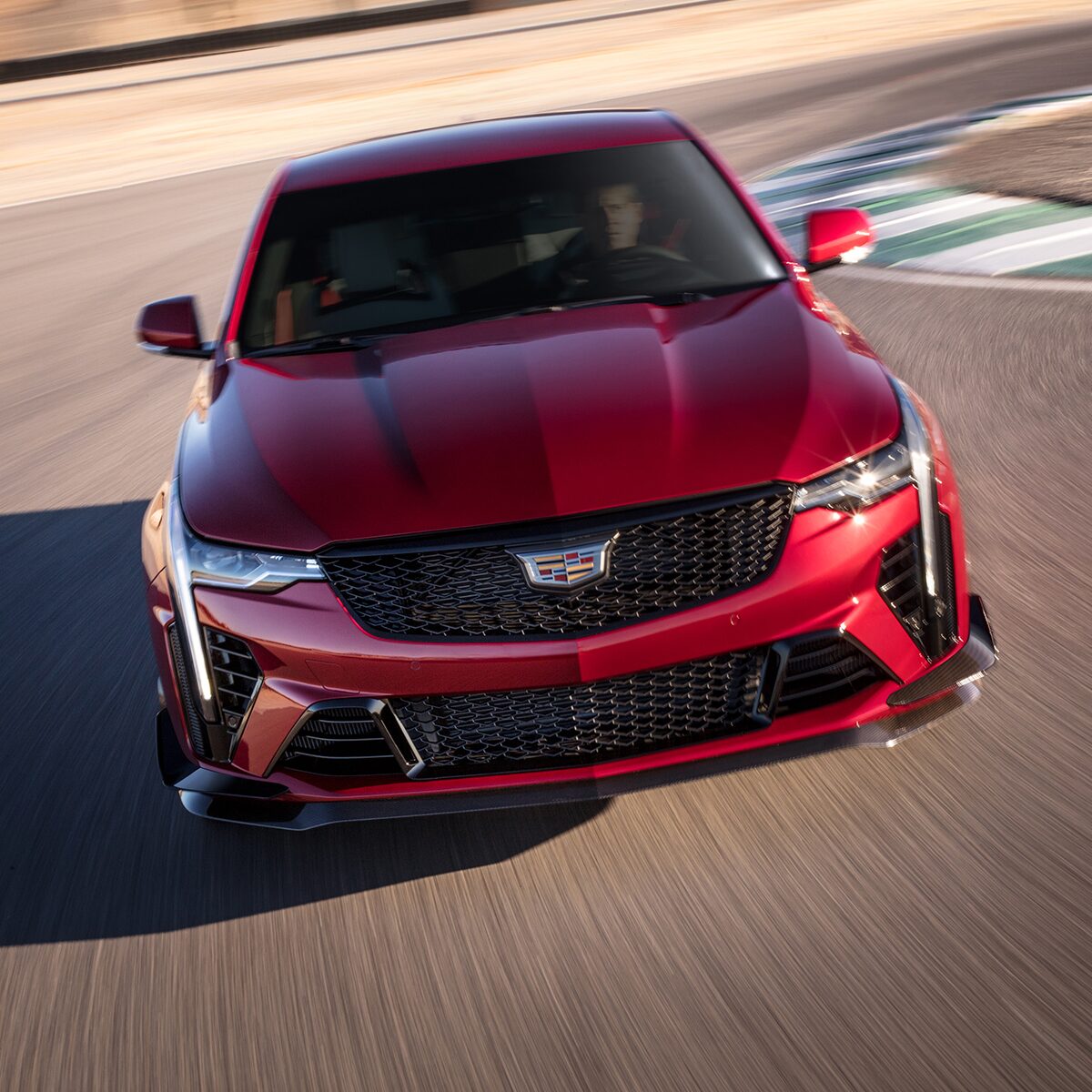 Front view of the 2023 Cadillac CT4-V driving on the road.