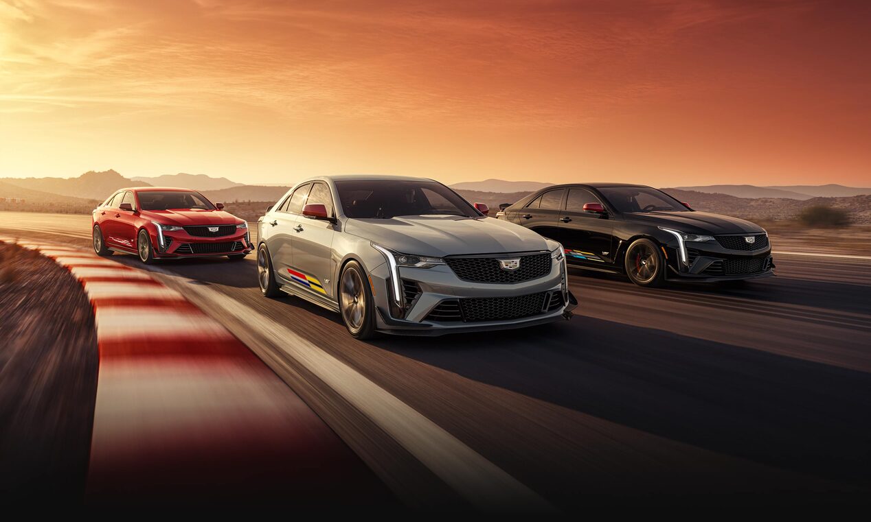 A trio of the 2024 CT4-V Blackwing Mondrian driving on the road.