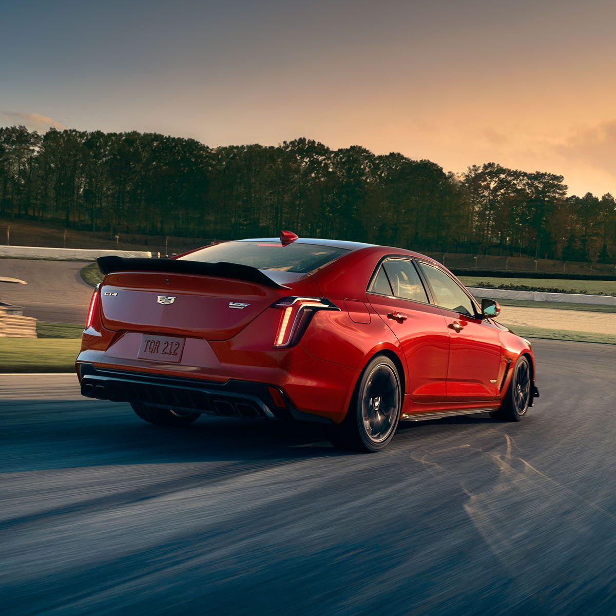 2026 Cadillac CT4-V luxury sports sedan driving alone on a seaside road.