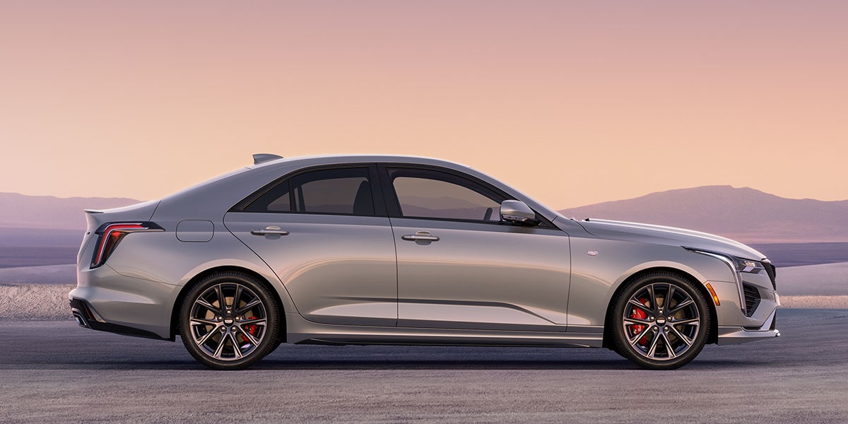 Side view of the 2026 Cadillac CT4 luxury sedan parked alone outside.