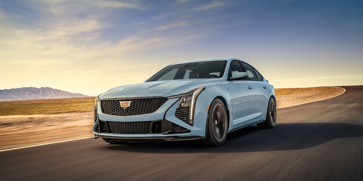 Front-side view of the 2026 Cadillac CT5-V driving in an arid road.