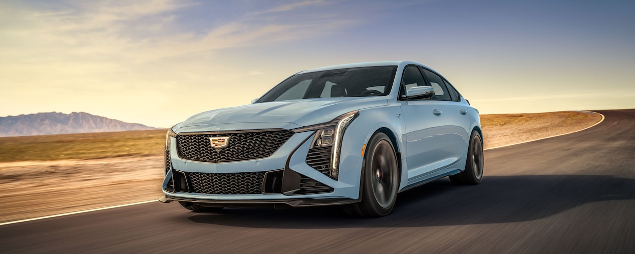 A Cadillac CT5-V Blackwing driving fast alone on the road.