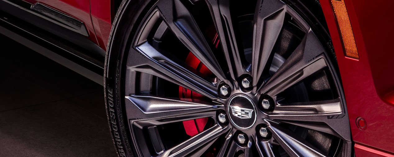 Close up view of the wheels of a Cadillac V-series vehicle.