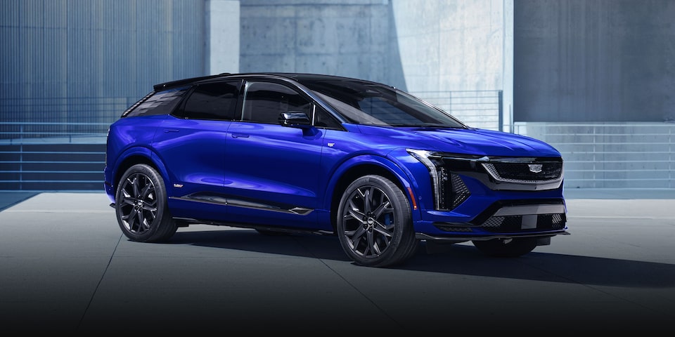 Side view of a Cadillac V-series.R race car driving fast on the race track.