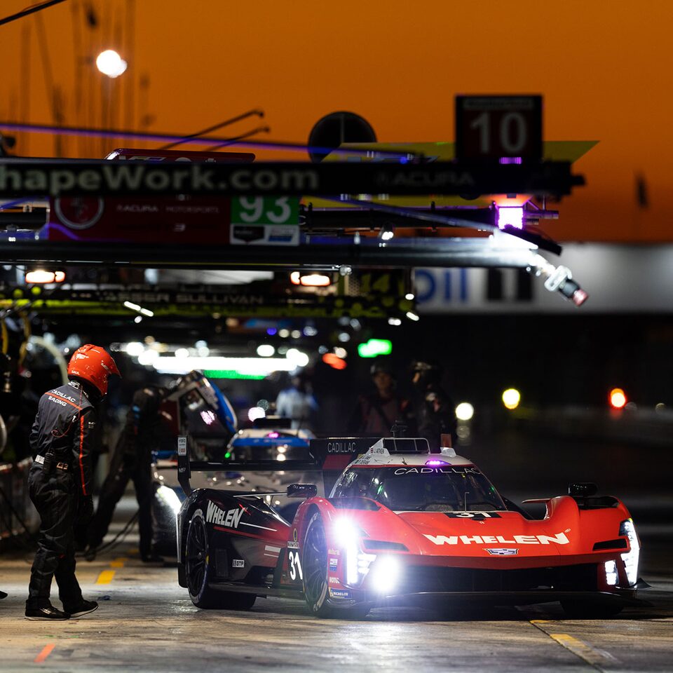 Cadillac race car on a pit stop.