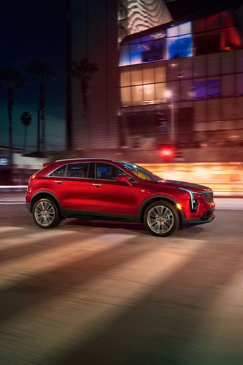 Right profile view of the 2024 XT4 driving on the road.