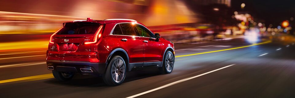 Scenic view of 2024 Cadillac XT4 driving down the highway.
