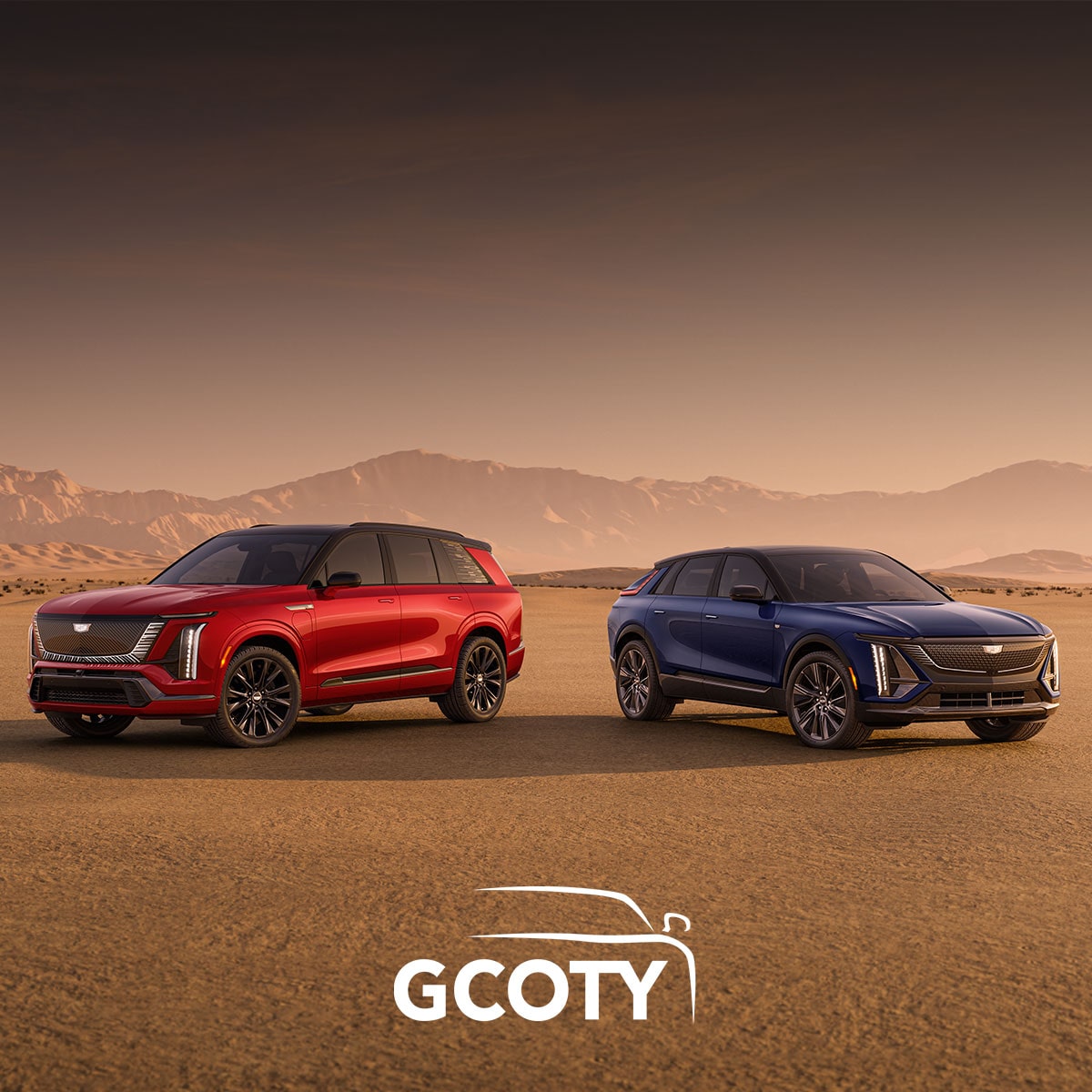 Two Cadillac SUVs Are Parked In a Desert Landscape Beneath Text Announcing Cadillac’s Back-To-Back German Luxury Car Of the Year Win Above the GCOTY Logo.