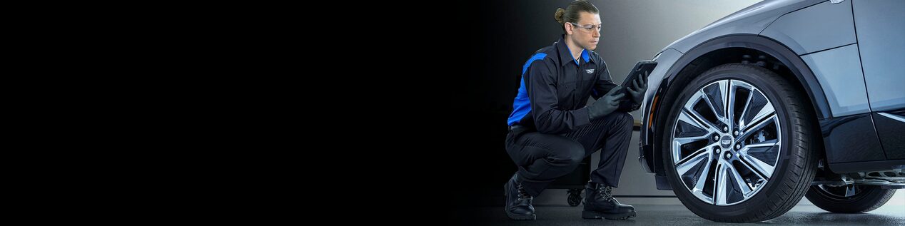 Cadillac LYRIQ Electric SUV Parked In Front of a Light Display