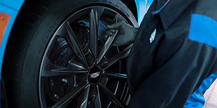 Closeup of a New Tire Being Installed on a Cadillac Vehicle