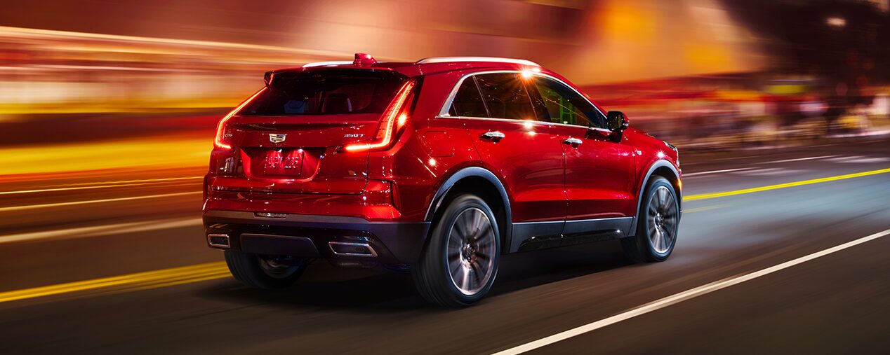Three Quarters Rear View of a Red Cadillac Vehicle Going Through a Tunnel