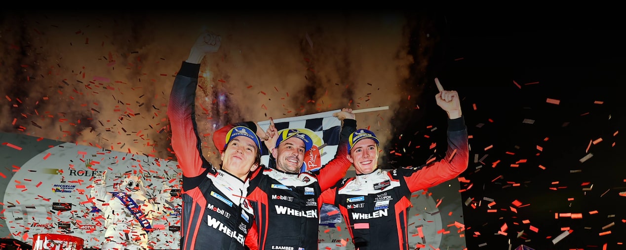 Three Members of the Cadillac Race Team Celebrating a Win Surrounded by Confetti
