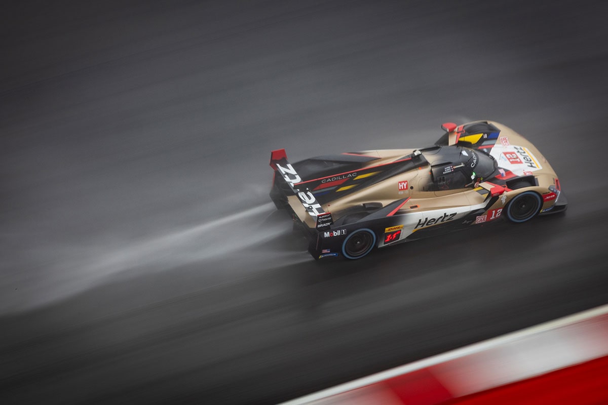 Birds Eye View of a Cadillac Race Car Speeding Down the Race Track