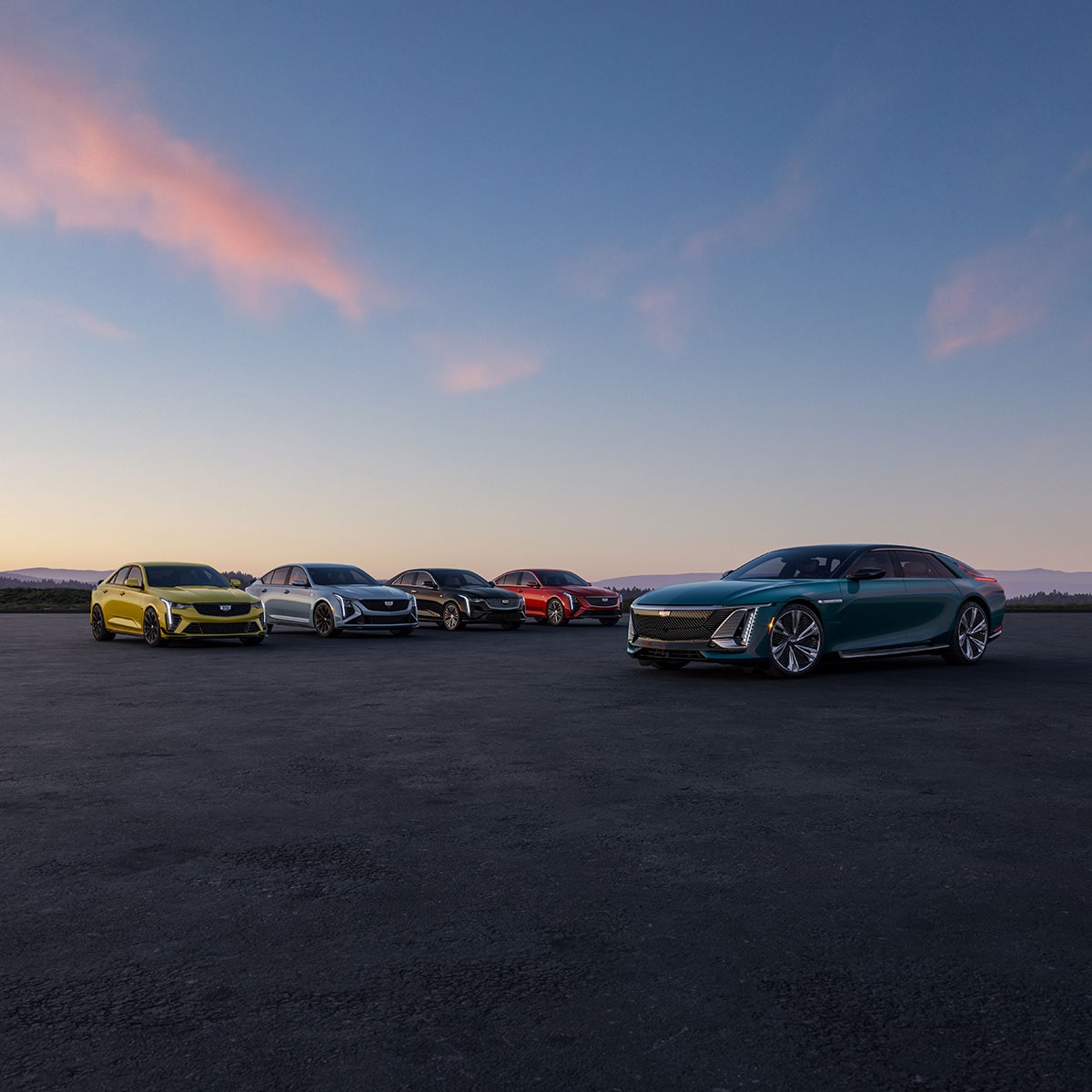 The Cadillac Sedan Line-up Parked in an Open Desert During Dusk
