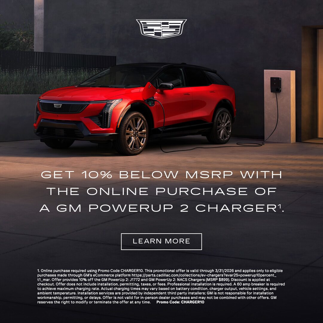 Three-quarter View of a 2025 Cadillac XT6 Parked Under a Beautiful Sky Next to a Current Offers Promotional Text