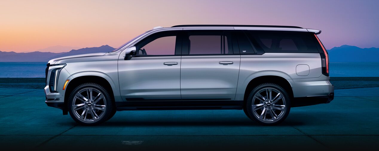 Passenger Side View of the Cadillac Escalade ESV Full-size SUV Parked During Dusk