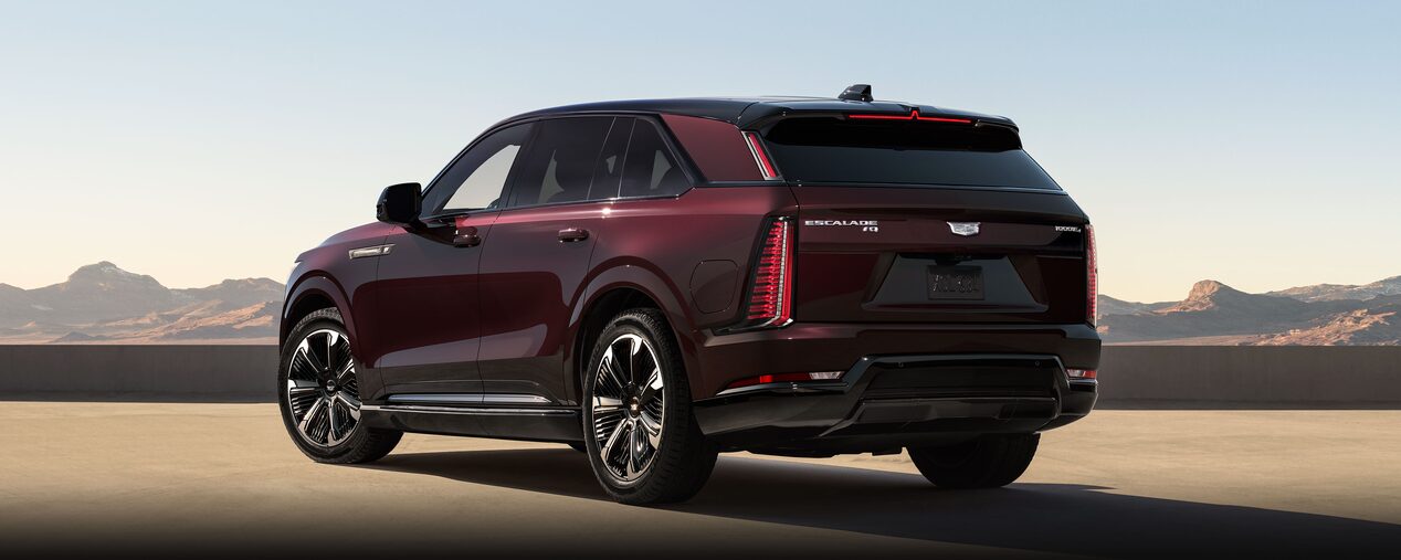 Front View of the 2026 ESCALADE IQ Luxury Electric SUV Parked During Dusk in the Desert