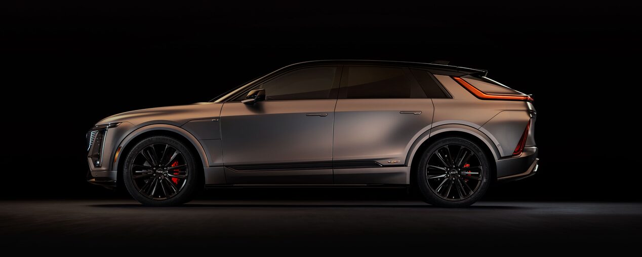 Side Driver View of the Cadillac LYRIQ-V Performance EV Parked in a Dark Showroom