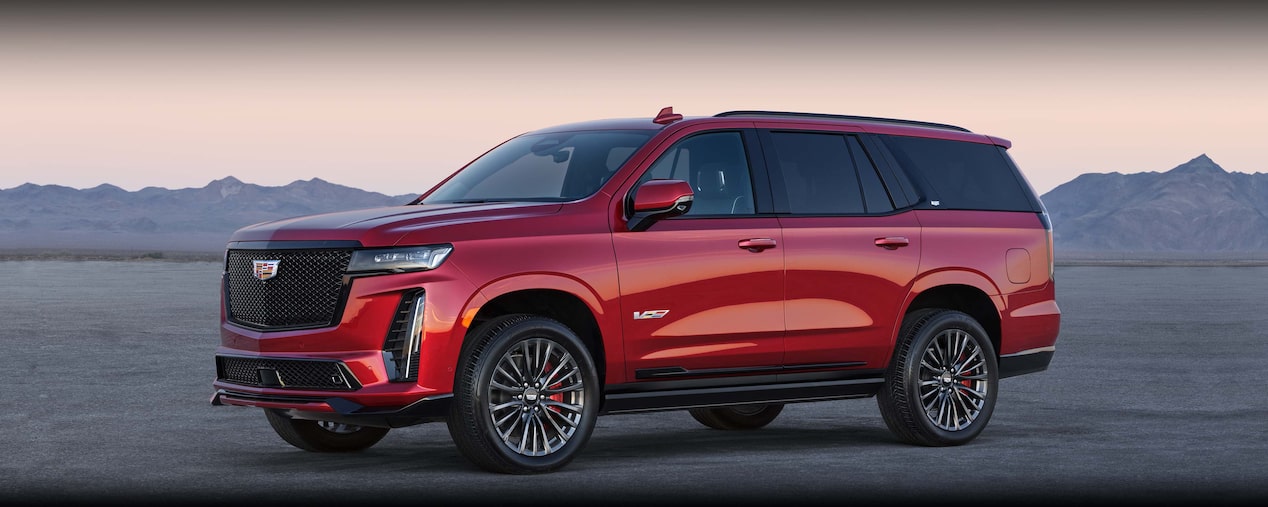 2024 Cadillac Escalade-V driving on an arid area.