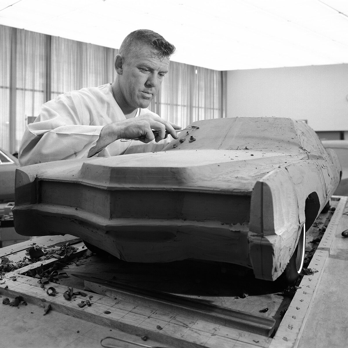 Sculptor at work on a scale model, 6/3/1965
